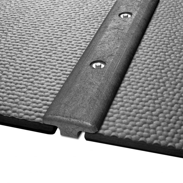 KRAIBURG KIM rubber stall mats with t-bar connector bar.