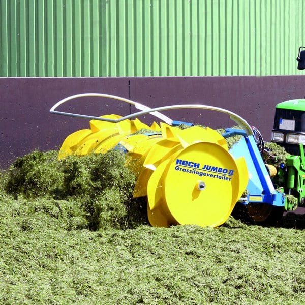 Farmer spreading silage with Agromatic RECK Jumbo II Silage Spreader.