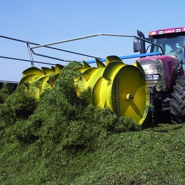 Farmer spreading silage with Agromatic RECK Jumbo II Silage Spreader.