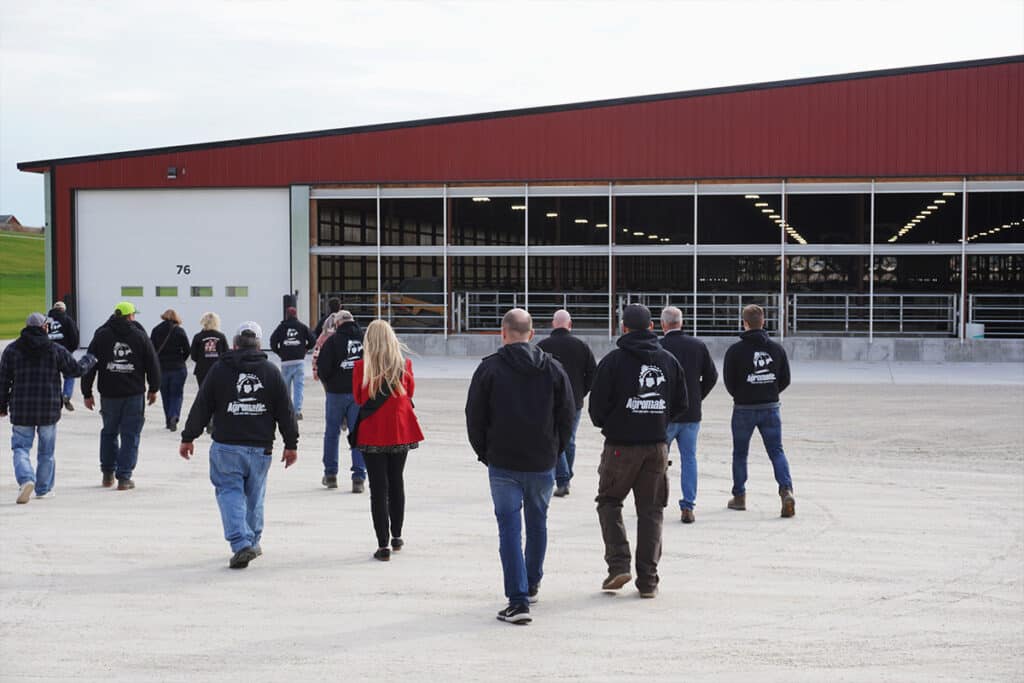 The Agromatic team with Alice in Dairyland arriving at Abel Dairy Farms cow barn.