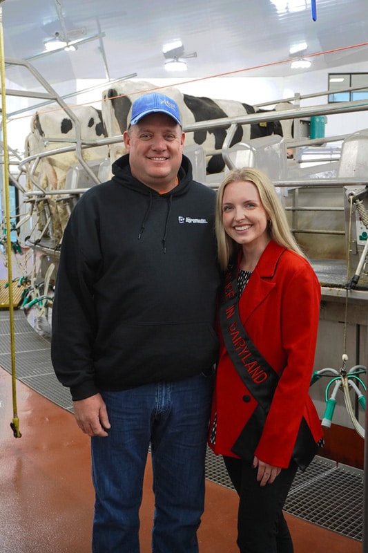 Steve Abel from Abel Dairy Farms with Alice in Dairyland.
