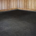Extra soft stall mats installed in a stable stall for horses.