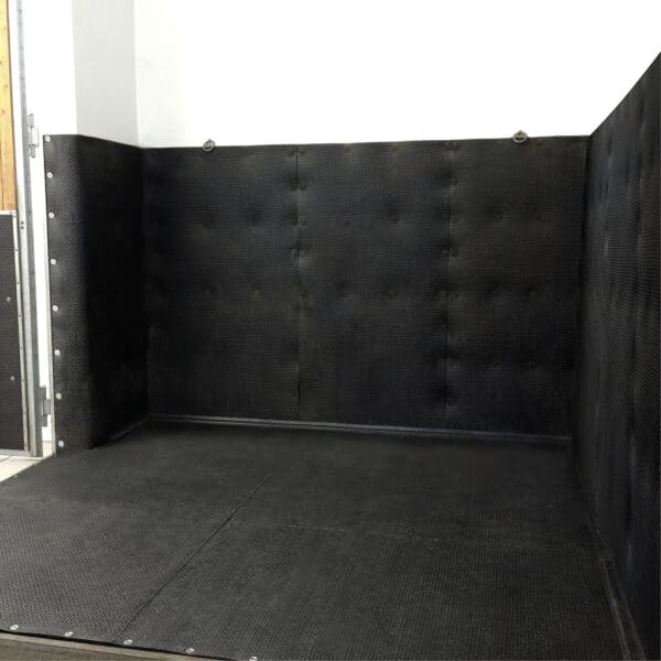 Padded soft stall recovery area for horses.