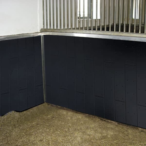 Rubber wall coverings in horse stall.
