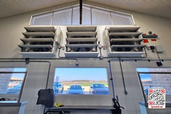 Electrical positive pressure fans inside building.