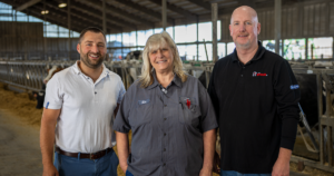 Habeck Homestead Farms LLC in Appleton, Wisconsin with Joscha Sadowski, Kim Habeck, and Erik Niemeier celebrating 20 year old dairy barn flooring.