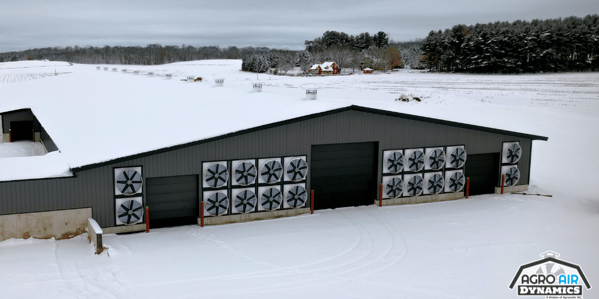 Agro Air Dynamics dairy barn ventilation systems finished installation of exhaust fans on an exterior wall of modern dairy barn in Wisconsin .