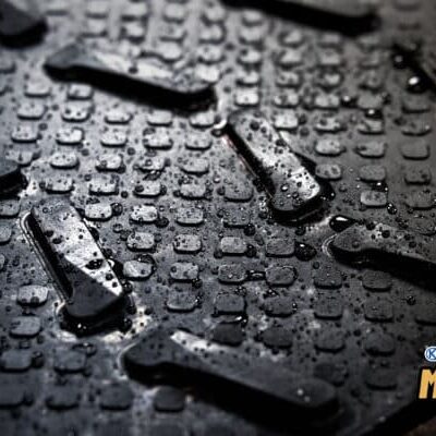 Wet slip resistant rubber mat. KRAIBURG MONTA cattle traction mats with water droplets on it.