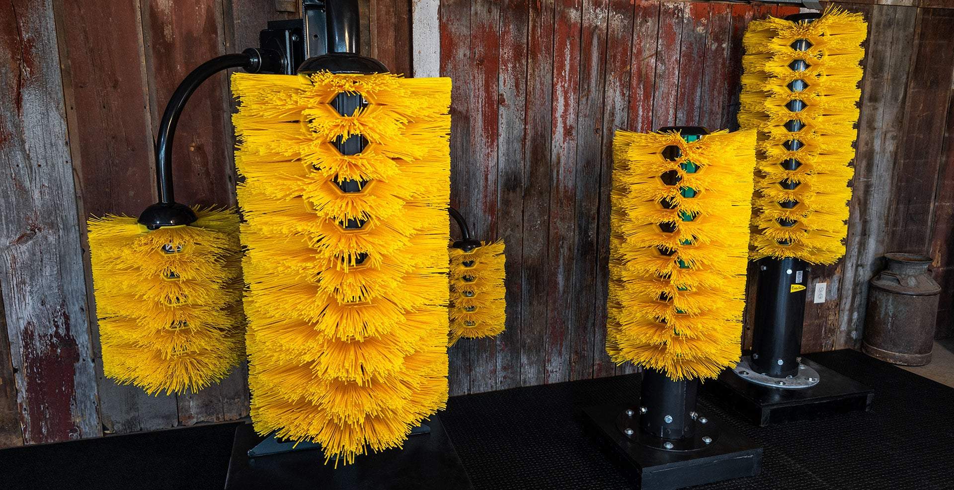 EasySwing Cow Brushes in different sizes. Displayed in the Agromatic showroom.