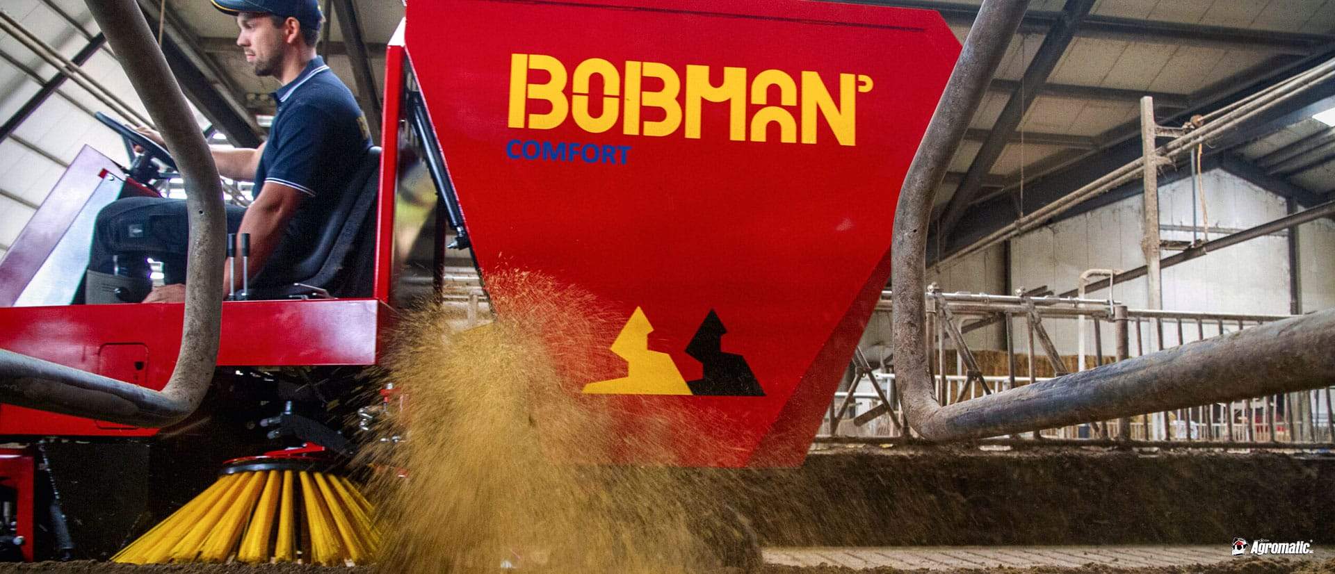 BOBMAN Machines free stall bedding equipment spreading fresh bedding in a barn.